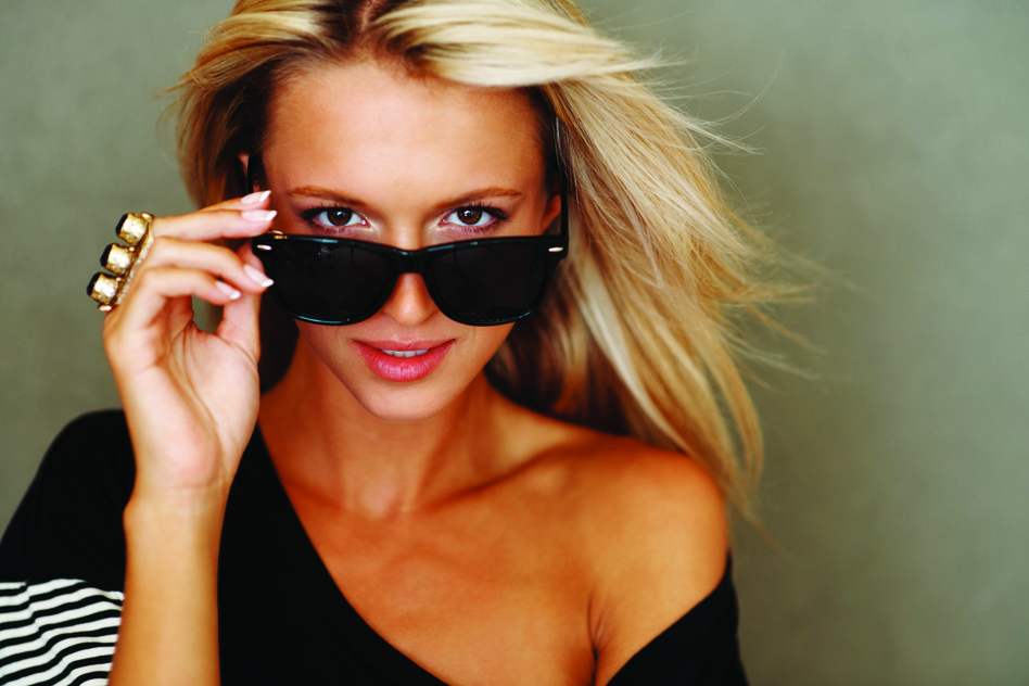 photodune-219914-cute-young-female-looking-through-sunglasses-s
